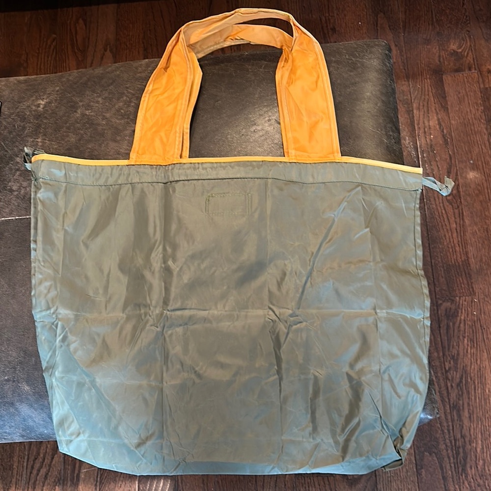 Brand New:Green and yellow Tote Bag.
Folds up into pocket for travel.